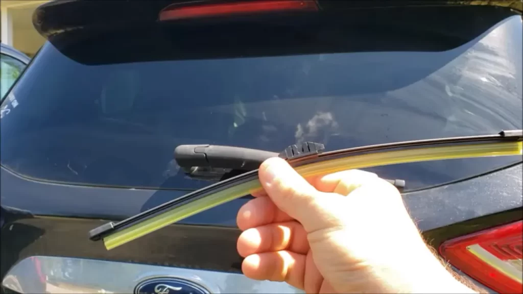 Lower the wiper arm back onto the windshield